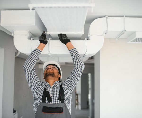 hvac services indian worker install ducted pipe system for ventilation and air conditioning in house hvac services indian worker install ducted pipe system for ventilation and air conditioning in house